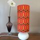 Two lamps with a seventies psychedelic wave print.