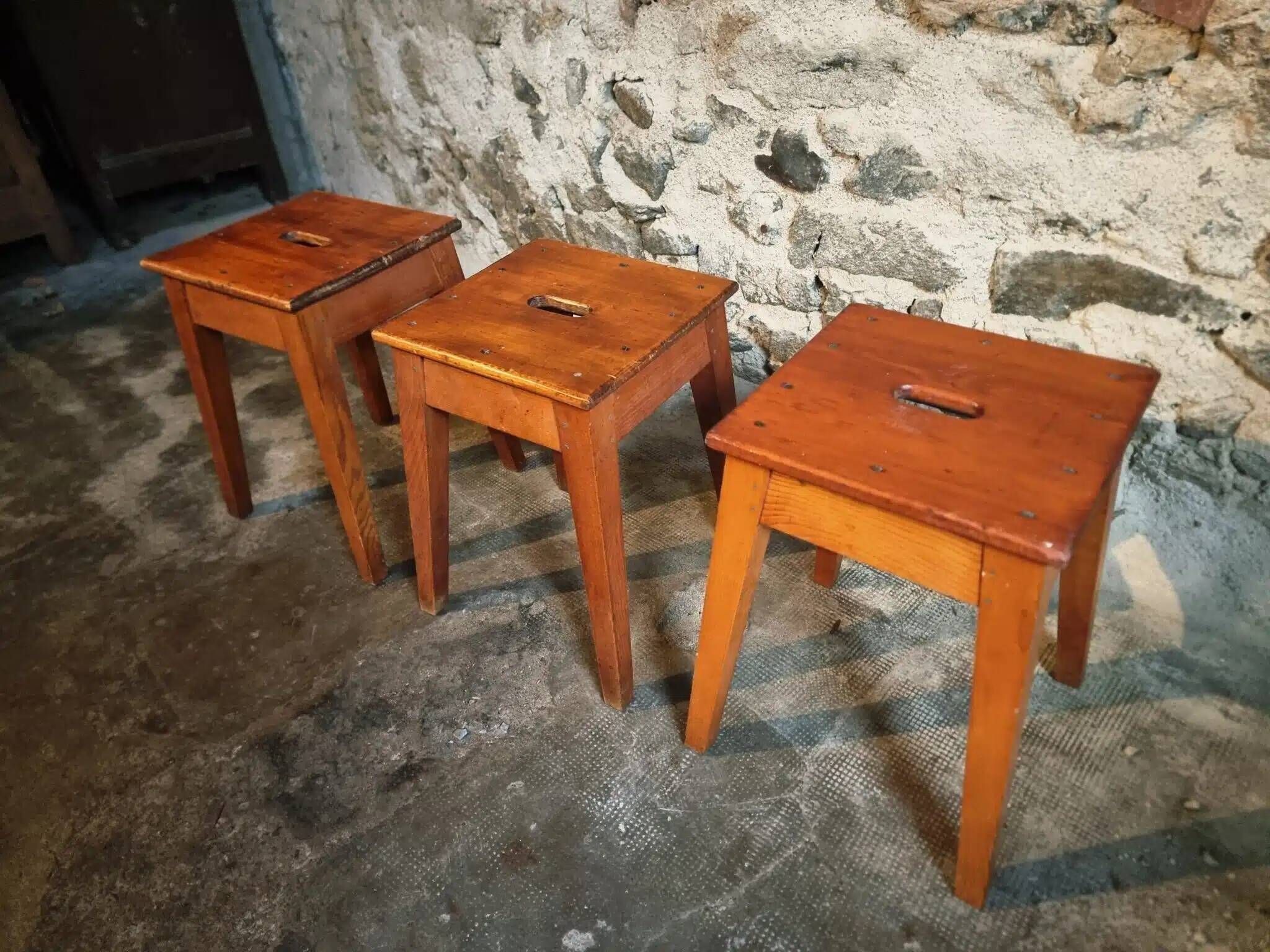 Set of 3 vintage French wooden stools from the 1950s.