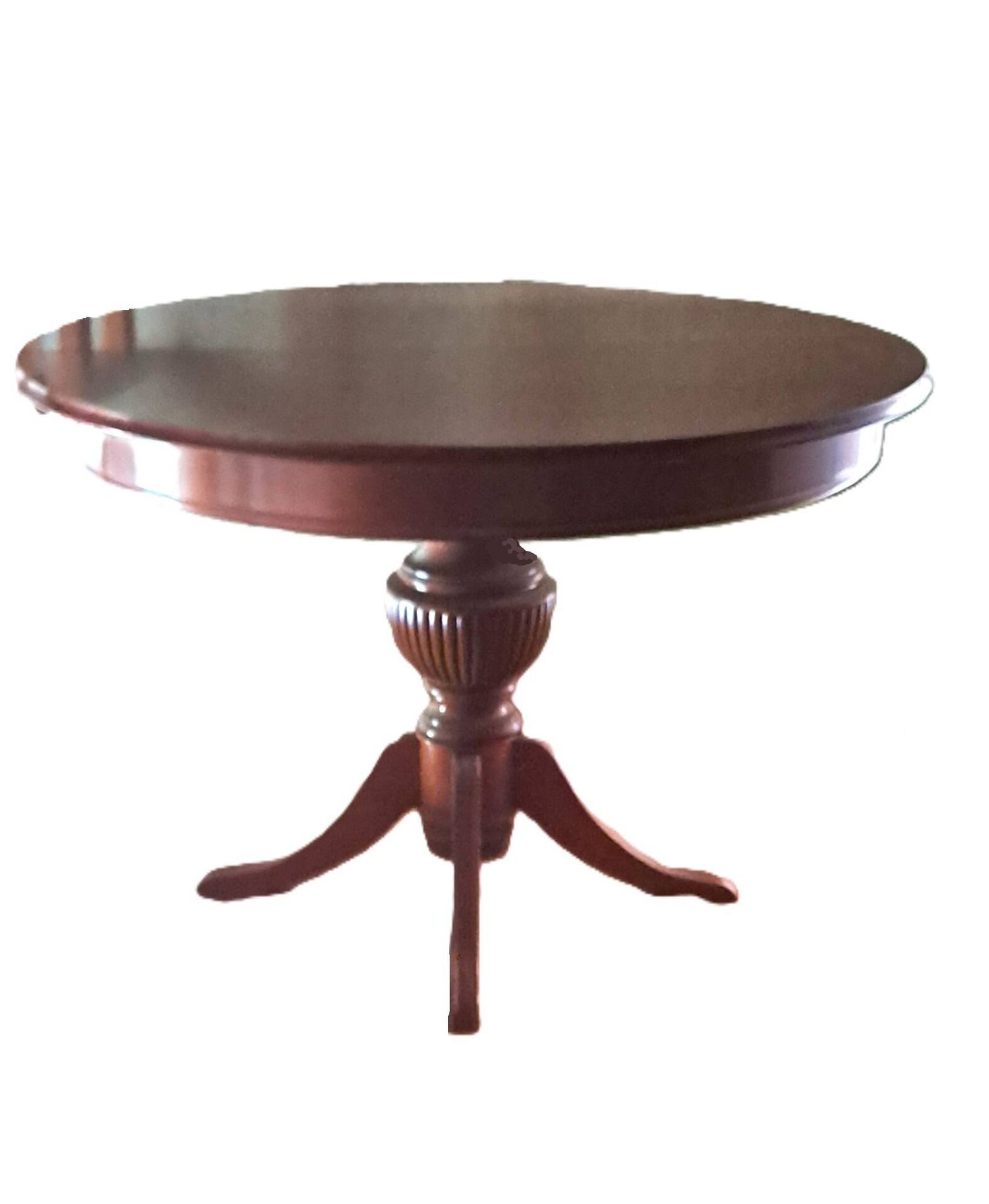 Round solid walnut table with central leg from the 1950s with extensions.
