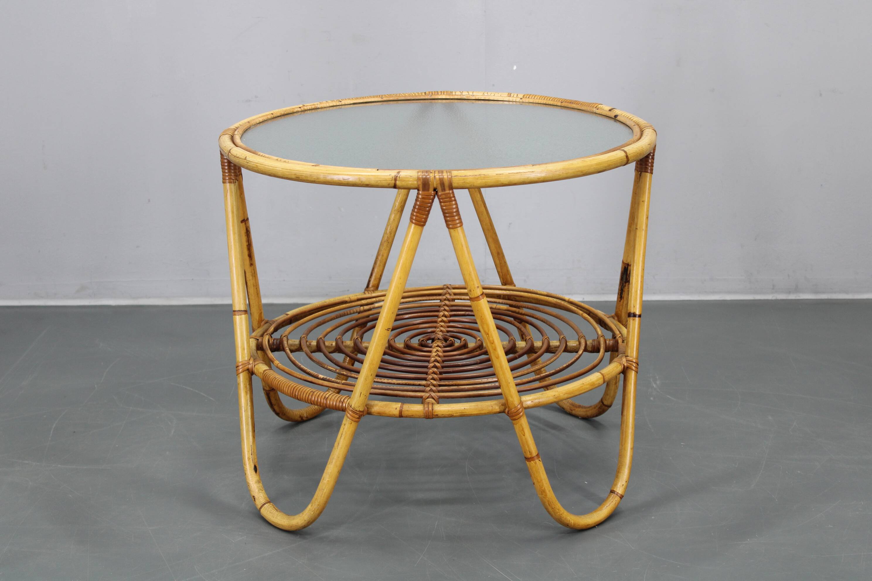 1960s Italian rattan coffee table with glass top, mid-century round design