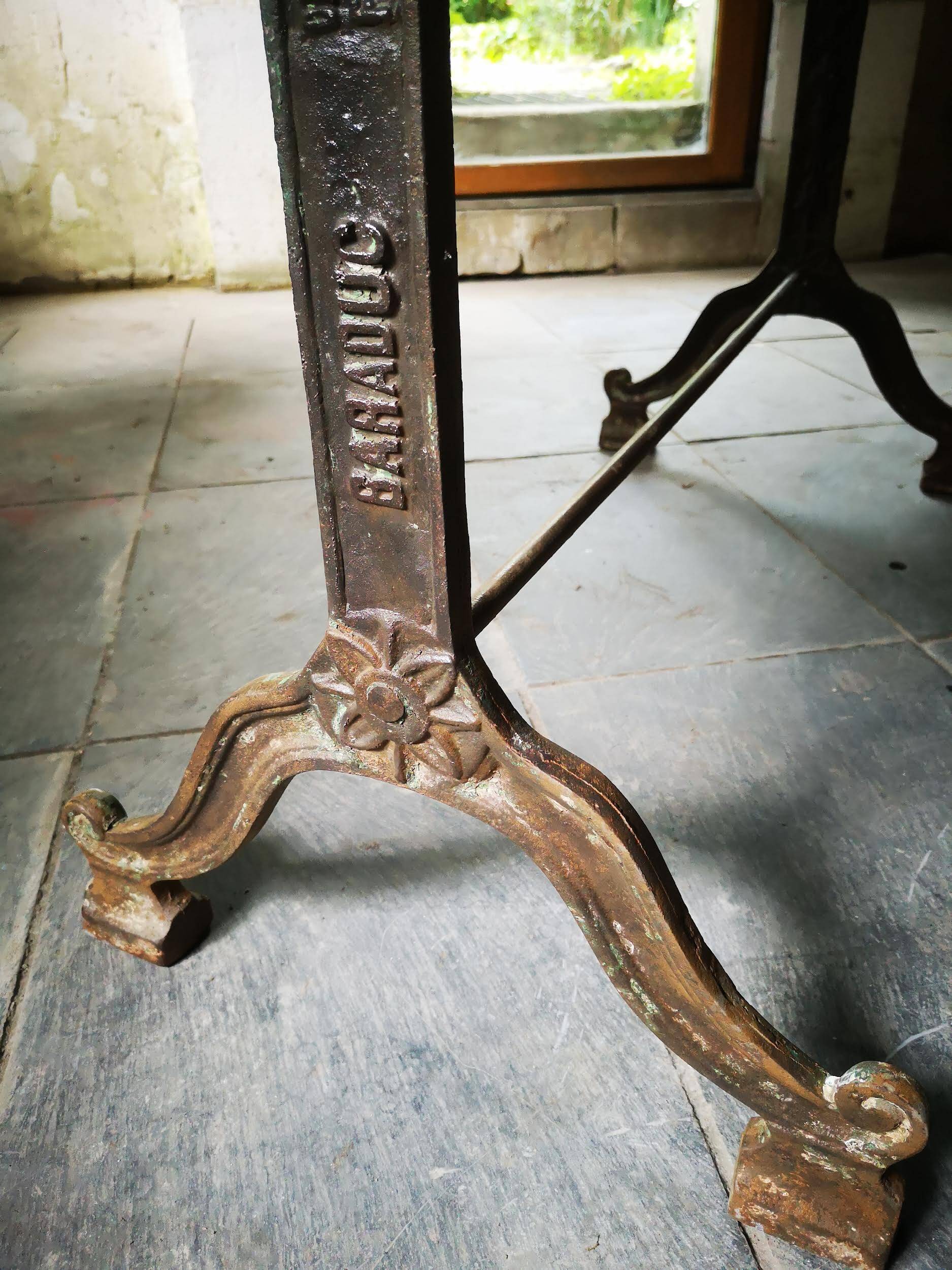 Old bistro table – cast iron legs and natural slate top