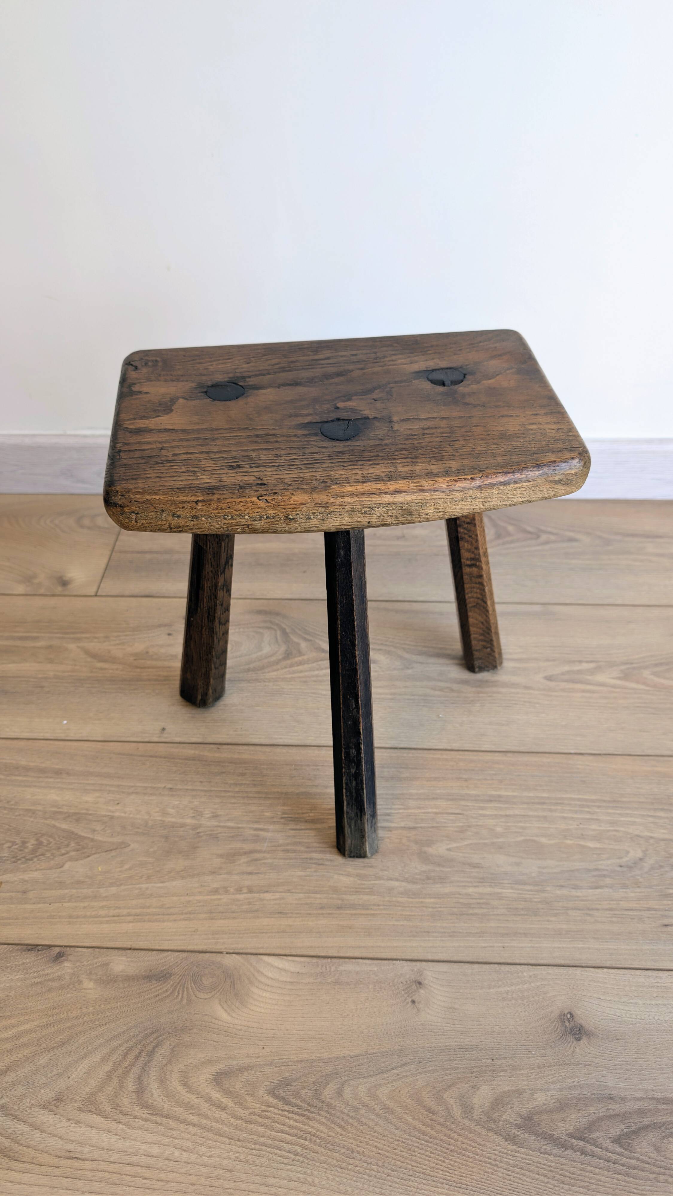 Antique tripod stool in patinated solid wood