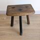 Antique tripod stool in patinated solid wood