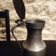 Vintage antique pewter serving jug with acorn finials on lid