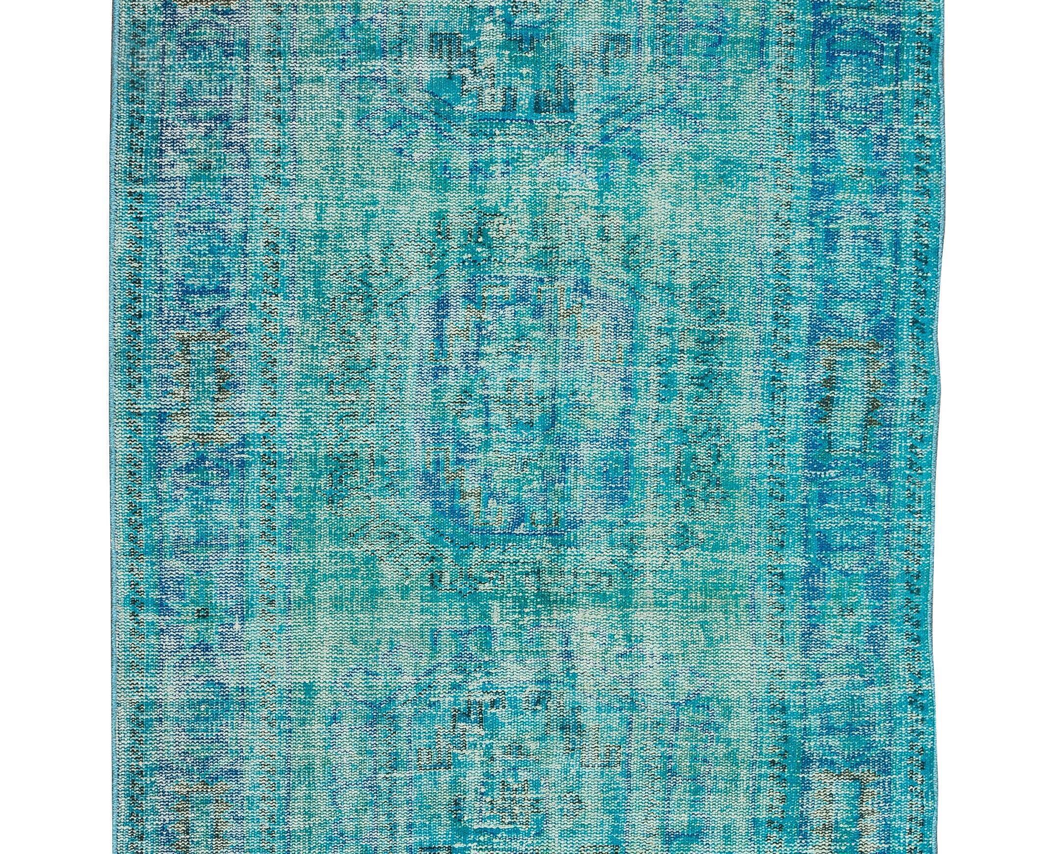Vintage turkish rug over-dyed in teal blue color