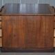 Antique Victorian oak kneehole desk with 18 double-sided drawers.