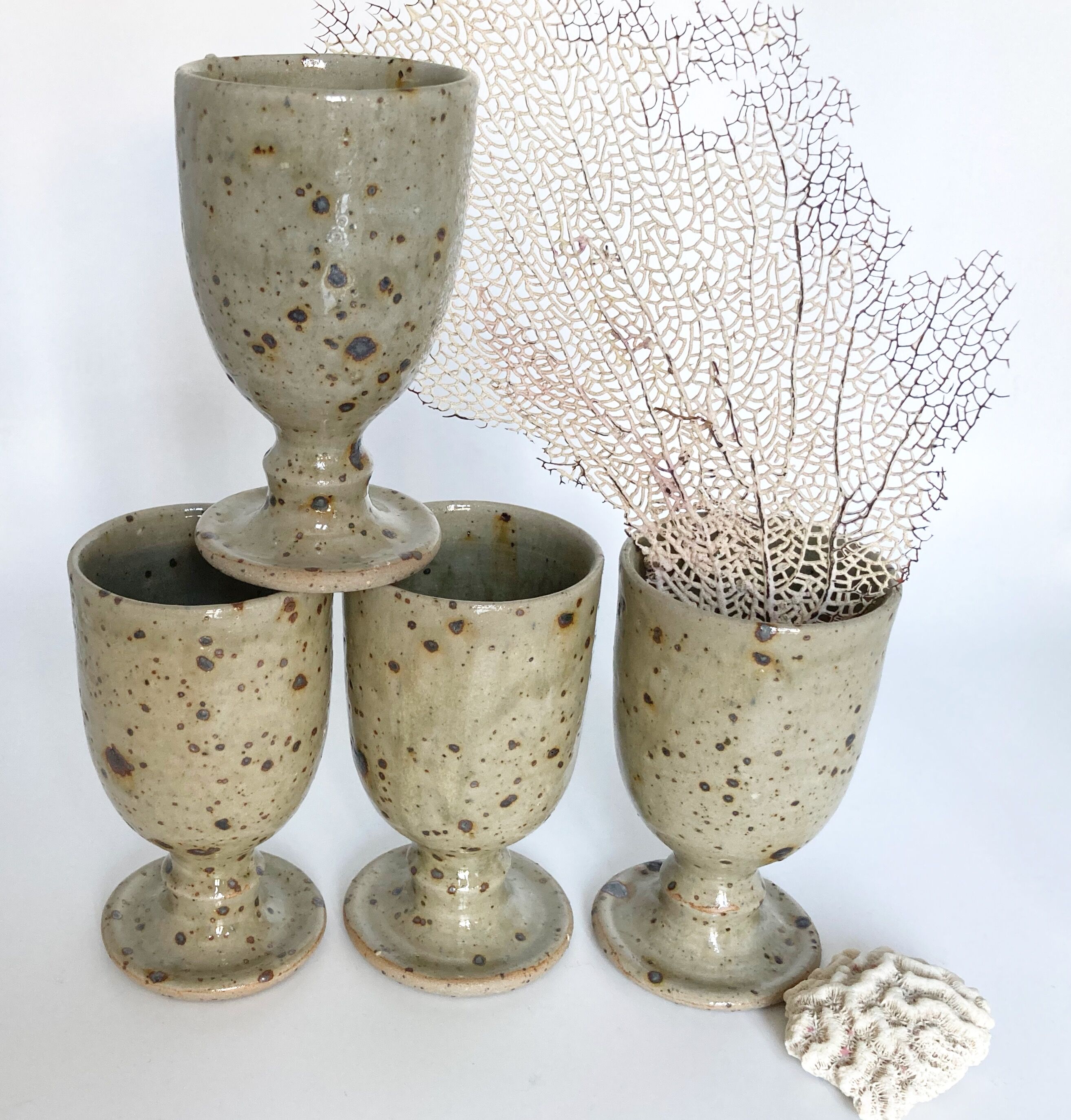 Four cups made of pyrity sandstone