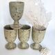 Four cups made of pyrity sandstone