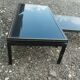 Vintage metal coffee table with glass top.