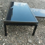 Vintage metal coffee table with glass top.