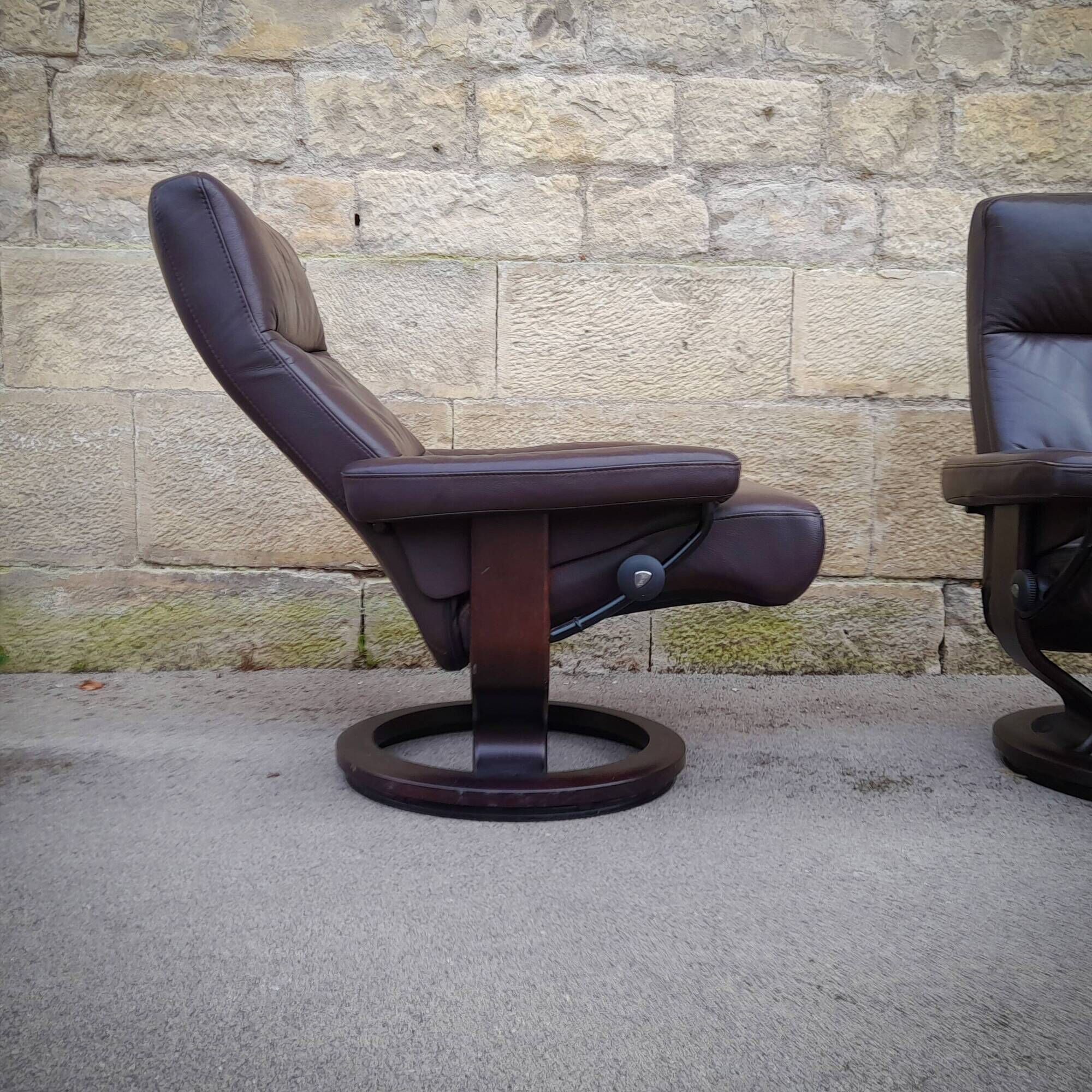Pair of Scandinavian leather armchairs and ottoman, Ekornes, Norway, 1970