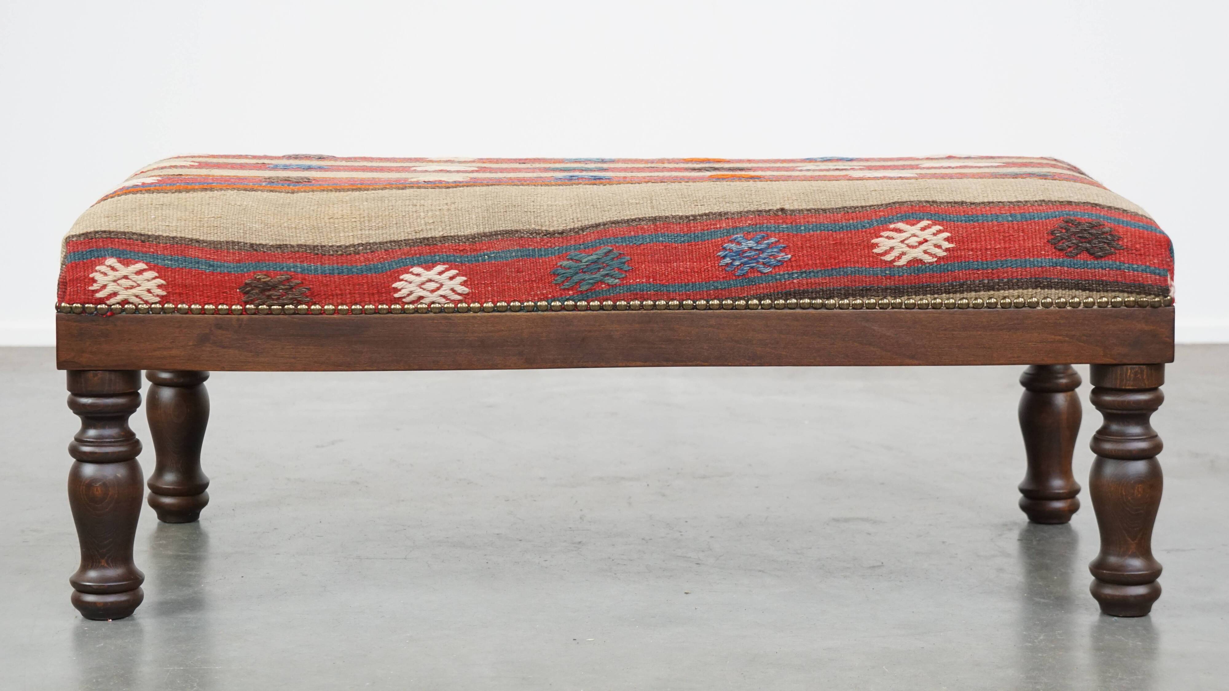 Oriental pouf upholstered in an antique kilim