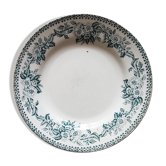 Assiette en faïence ancienne à décor de couronne de fleurs
