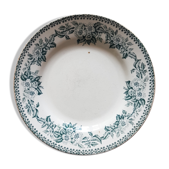 Assiette en faïence ancienne à décor de couronne de fleurs