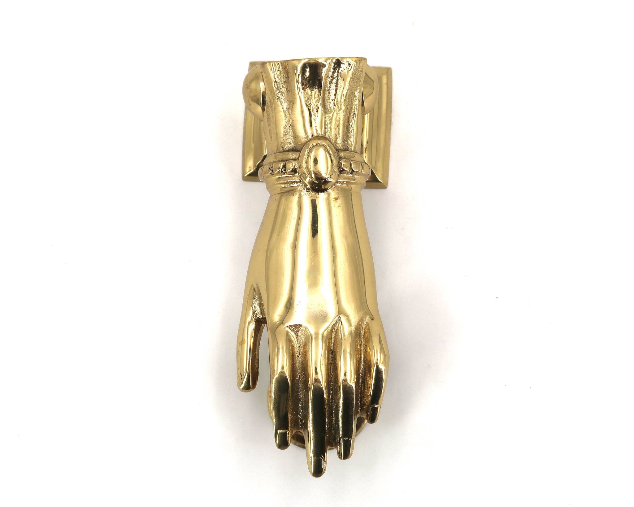 Brass door knocker in the shape of a hand, 1970s.