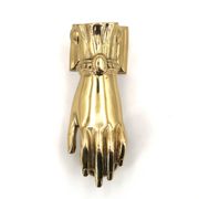 Brass door knocker in the shape of a hand, 1970s.