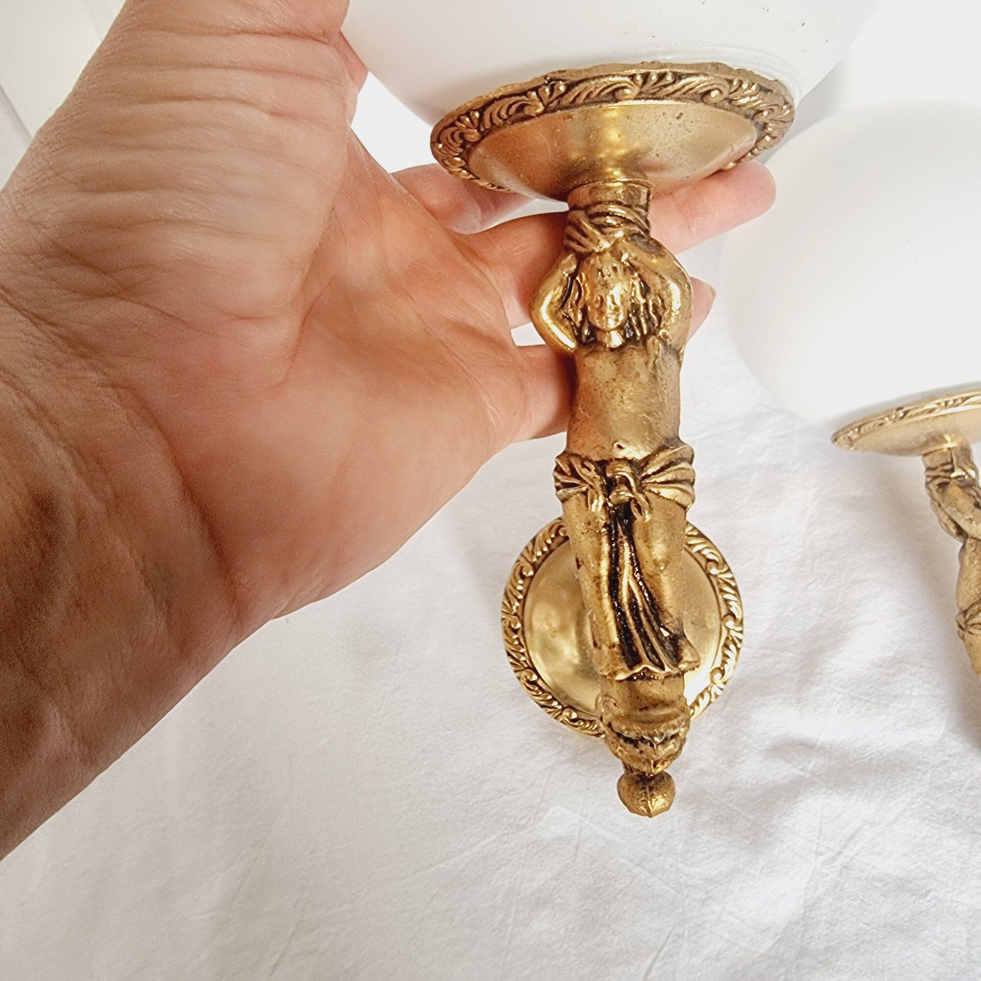 2 classic golden cherub wall lights and globe lampshades in perfect condition.