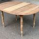 Renovated 18th century solid wood extendable round dining table with shutters