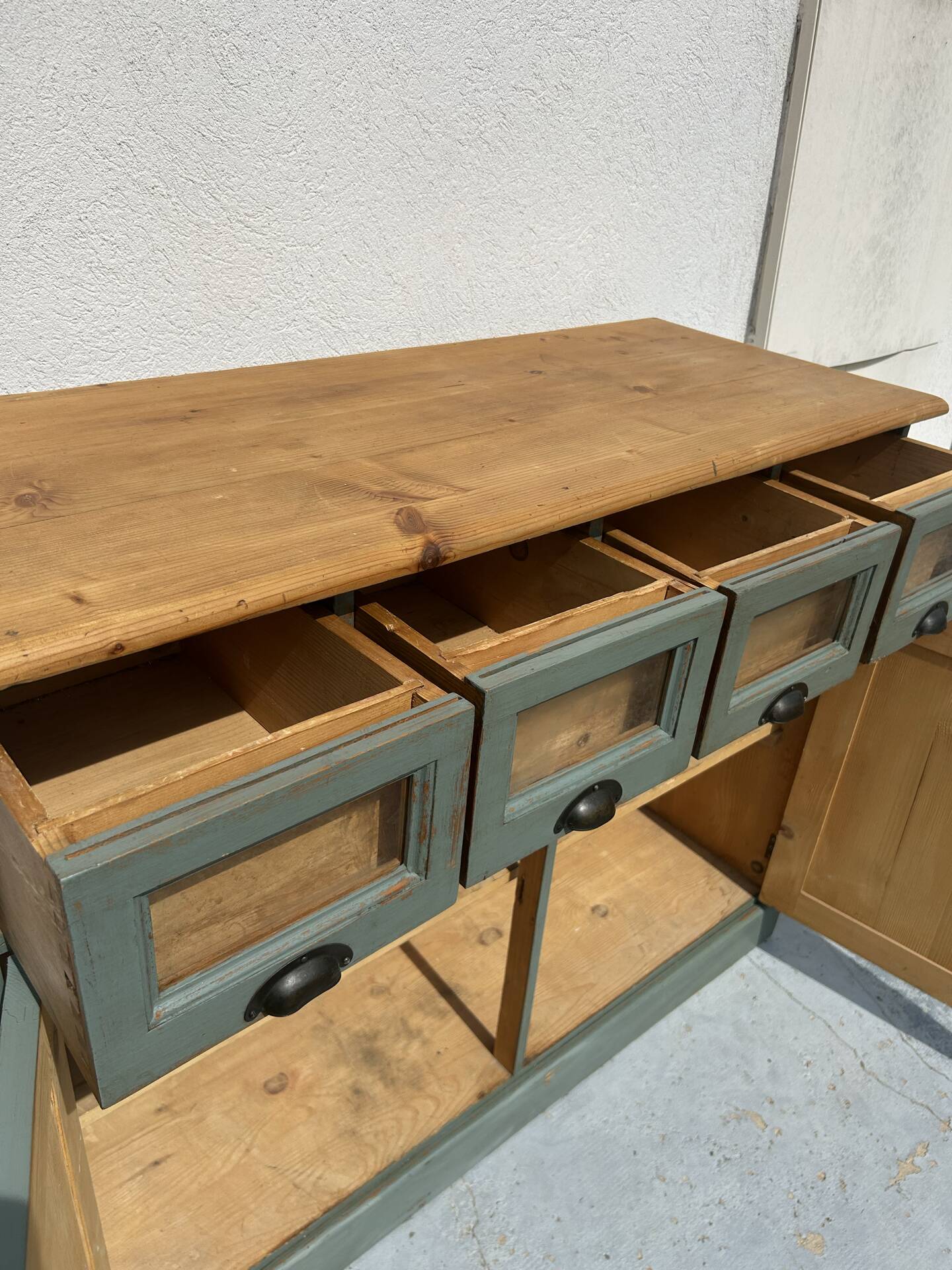 Antique counter cabinet with drawers and label holders – green patina