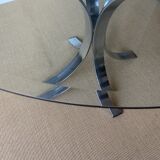 Round glass dining table, circa 1970.