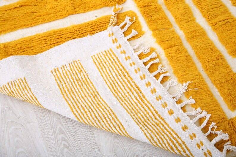 Handmade pure wool rug in traditional yellow, size 150 x 250 cm.