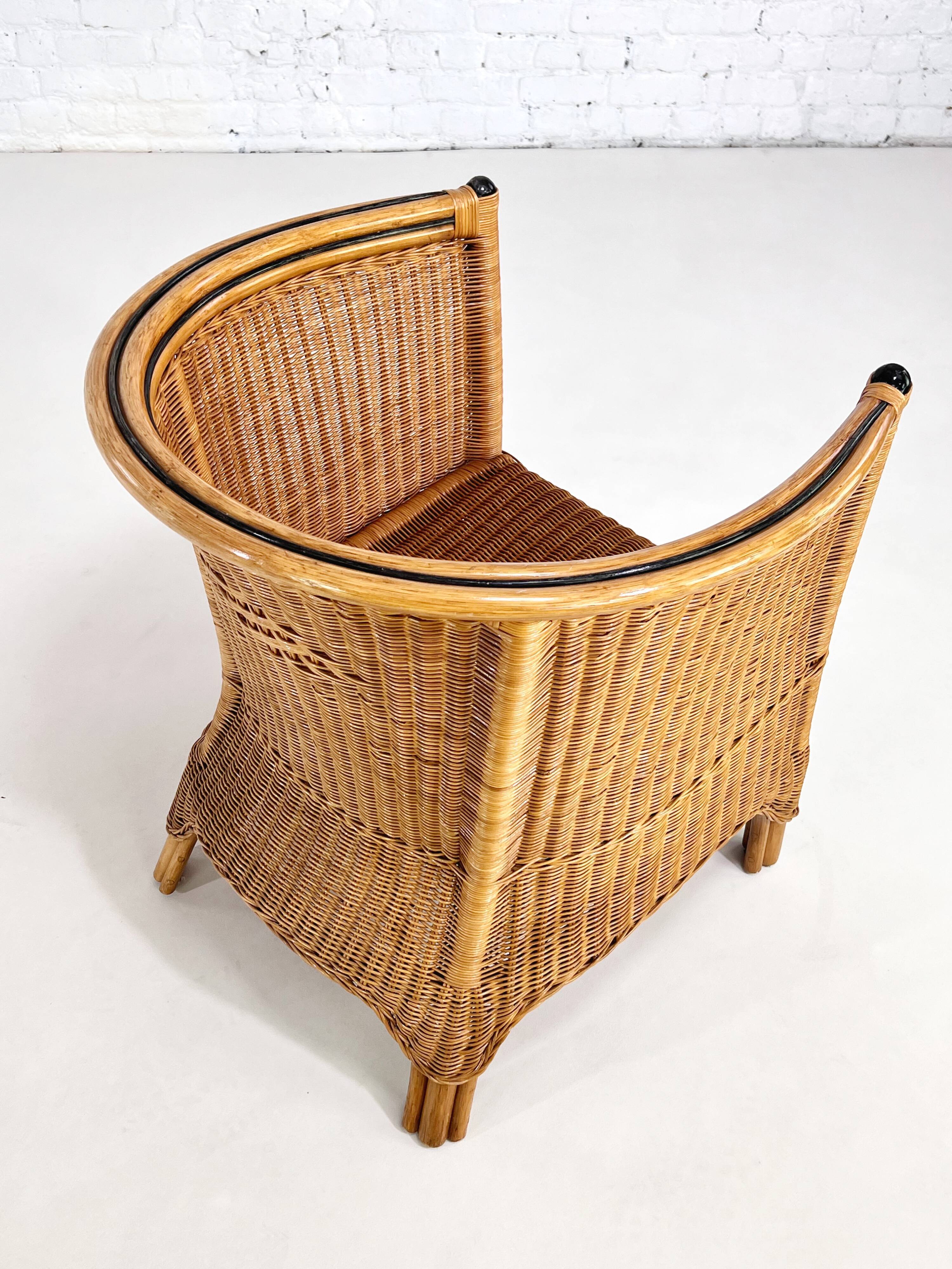 Pair of cabriolet armchairs in wicker and black edging