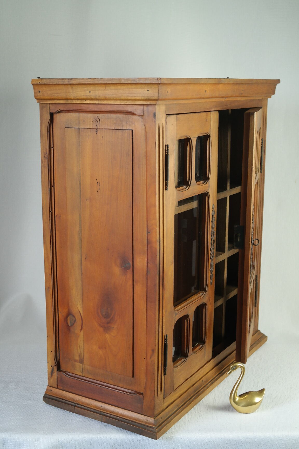 Antique walnut display cabinet from the 20th century.