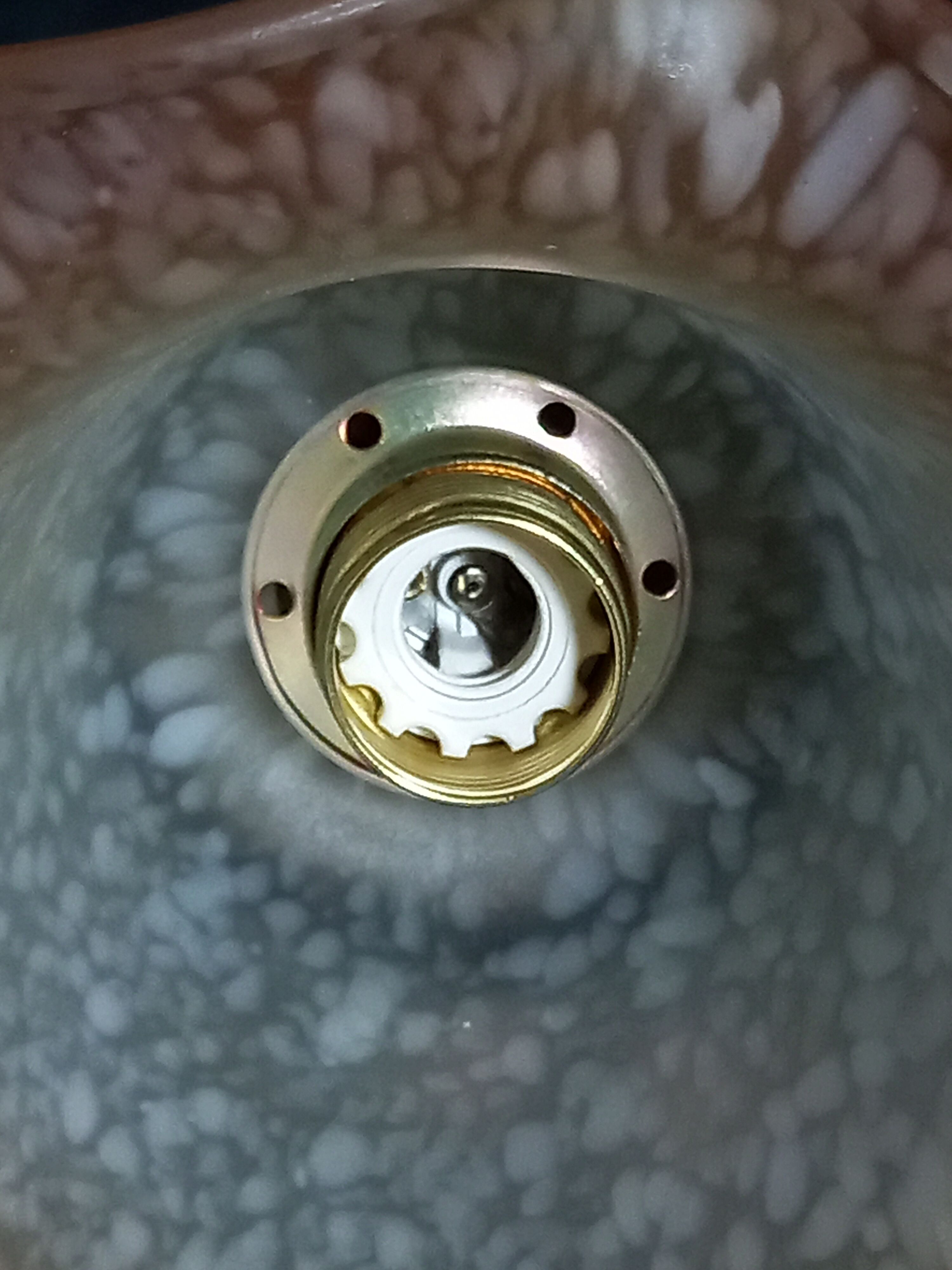 Brass wall lamp with speckled glass tulip