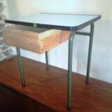 Child in formica desk