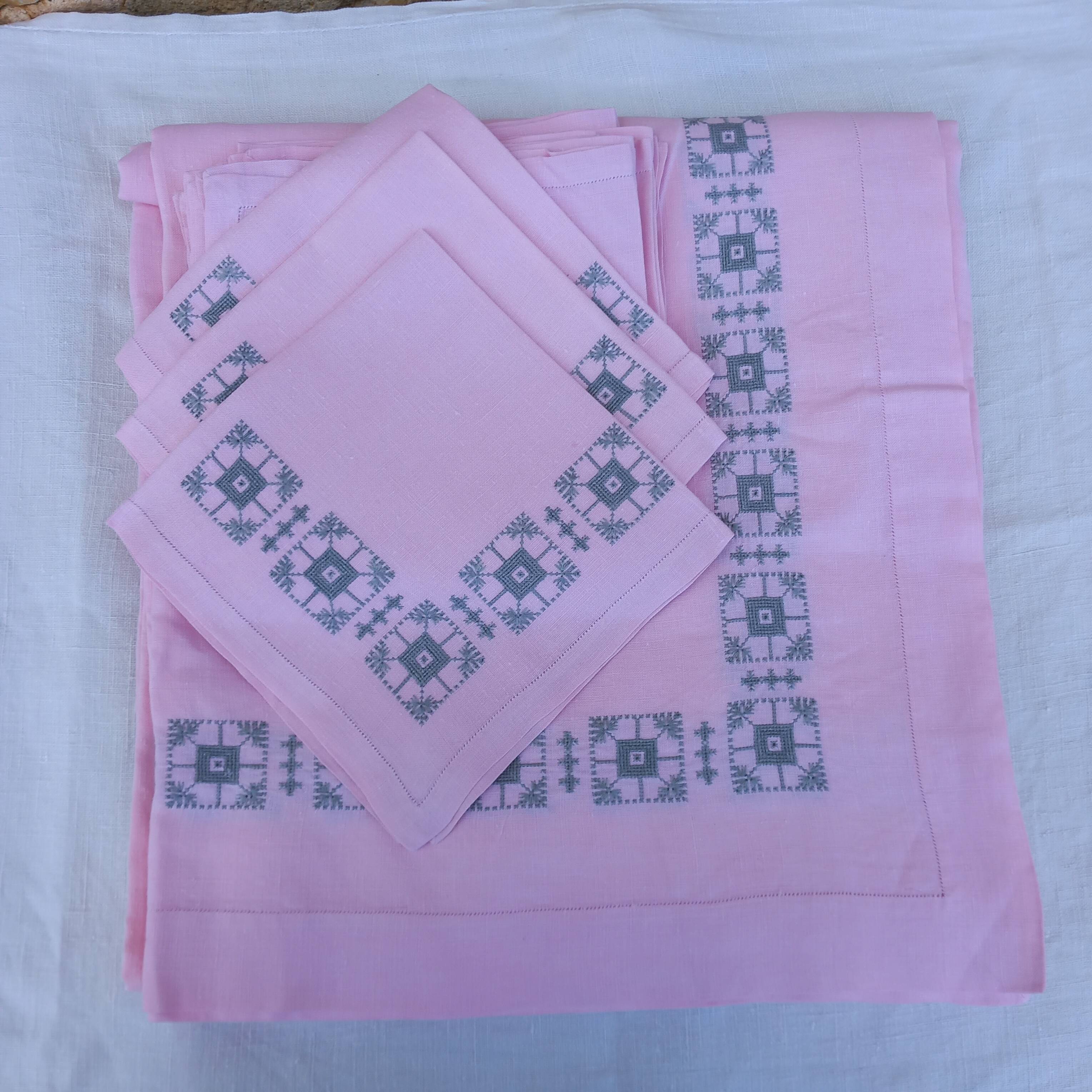 Large vintage linen tablecloth embroidered in pink and 12 matching napkins.