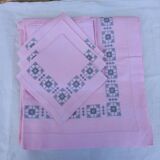 Large vintage linen tablecloth embroidered in pink and 12 matching napkins.