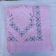 Large vintage linen tablecloth embroidered in pink and 12 matching napkins.