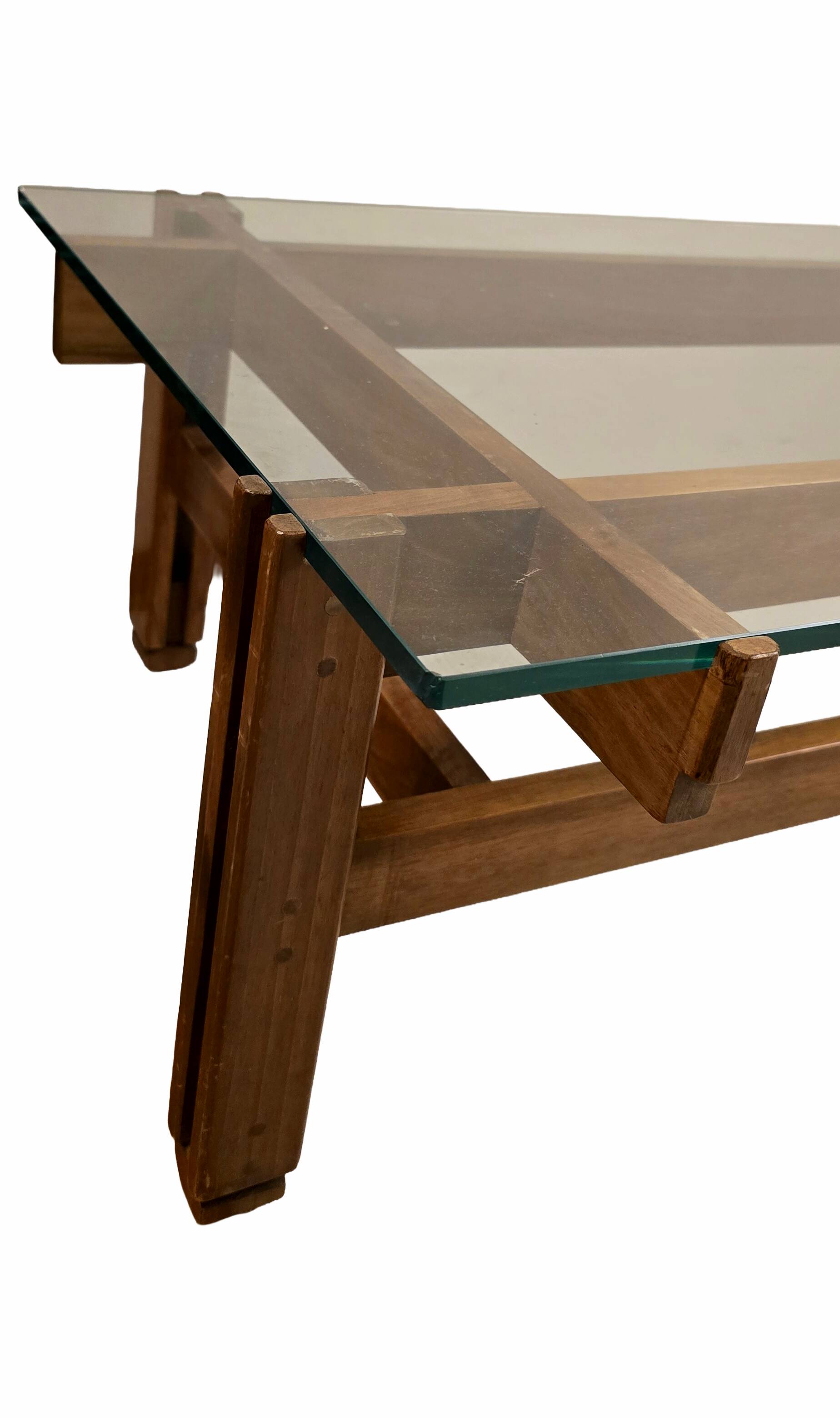 Glass coffee table with a wooden frame.