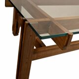 Glass coffee table with a wooden frame.