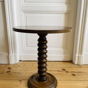 Turned wooden side table