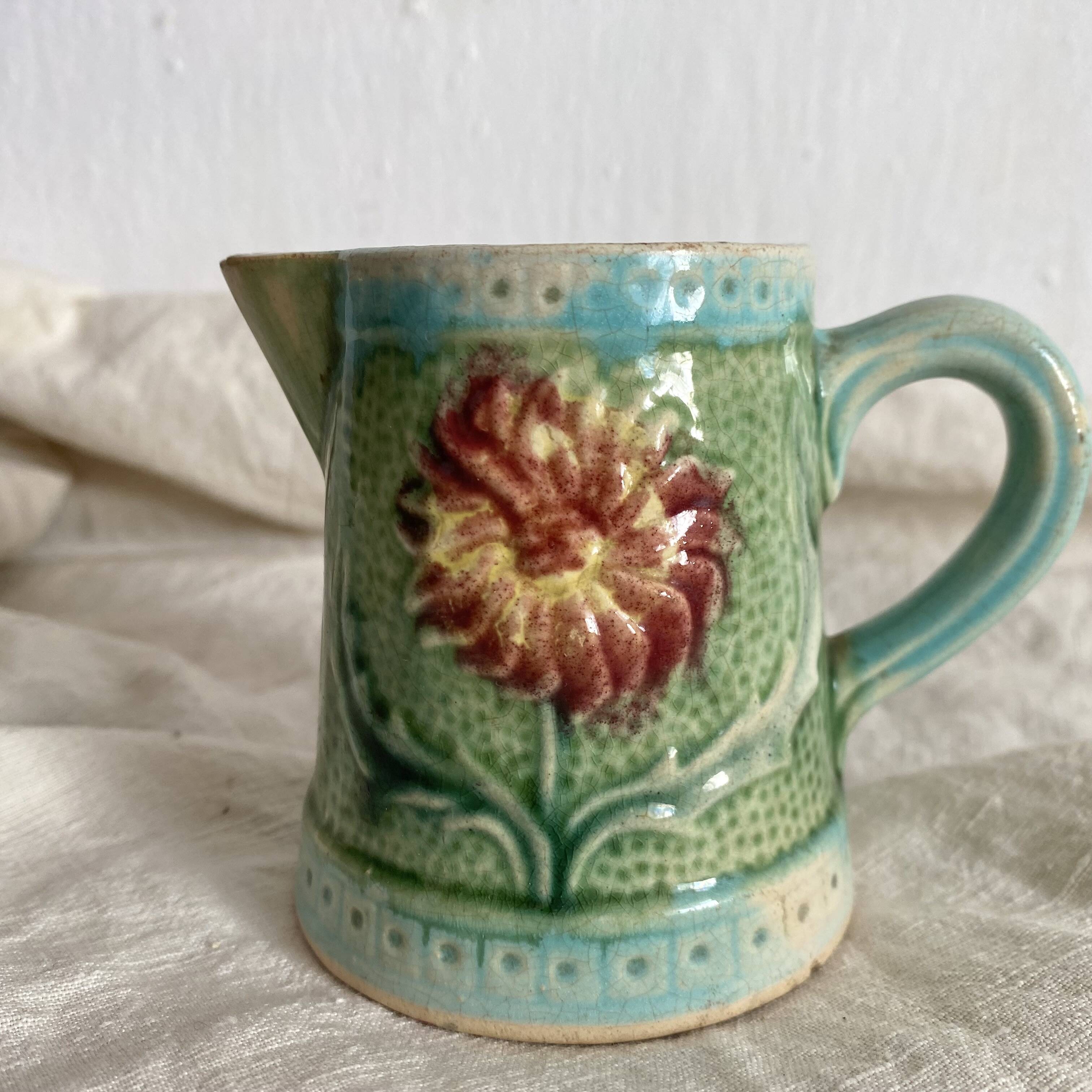 Small Art Nouveau slip milk pitcher