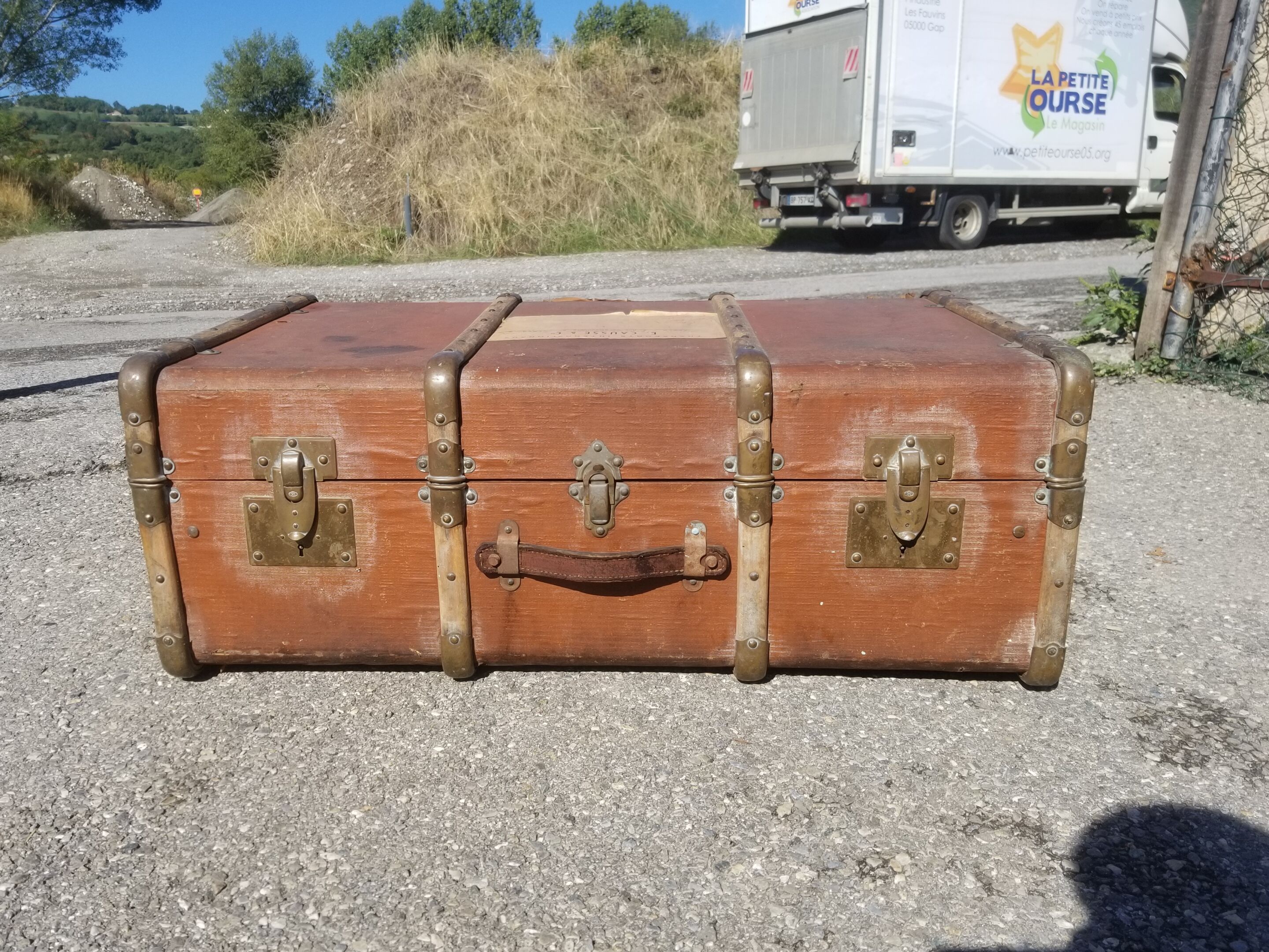 Old travel trunk made of wood and brass