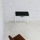 Tubular steel console, black glass tray, circa 1950