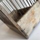 Old bird cage in wood and steel