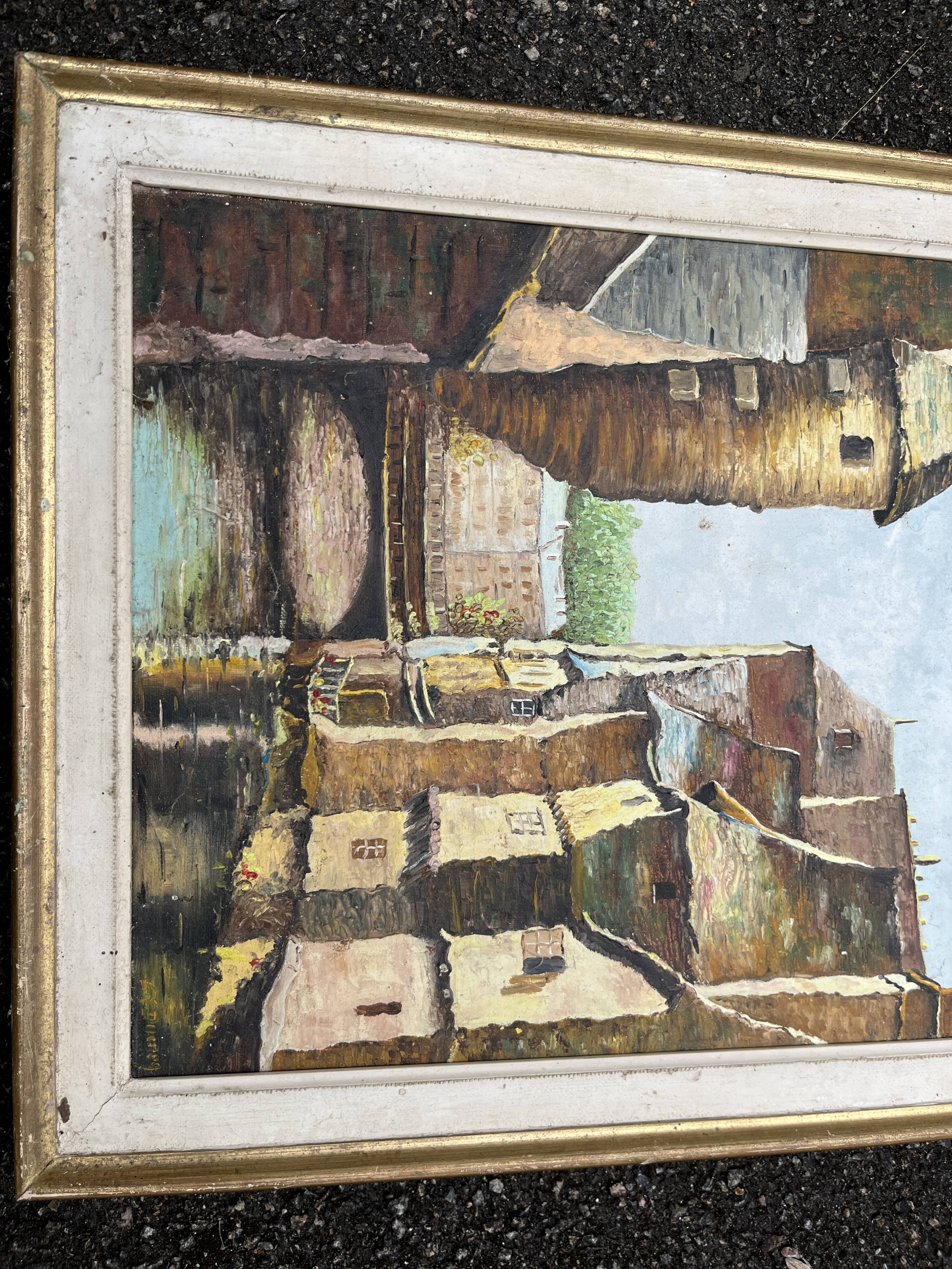Antique painting – Medieval village scene by the water, signed