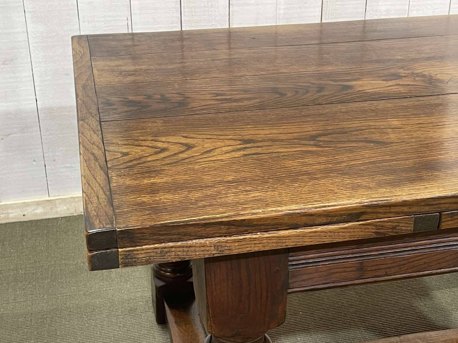 English monastery table with extensions from the late 19th century in elm and oak.