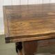 English monastery table with extensions from the late 19th century in elm and oak.