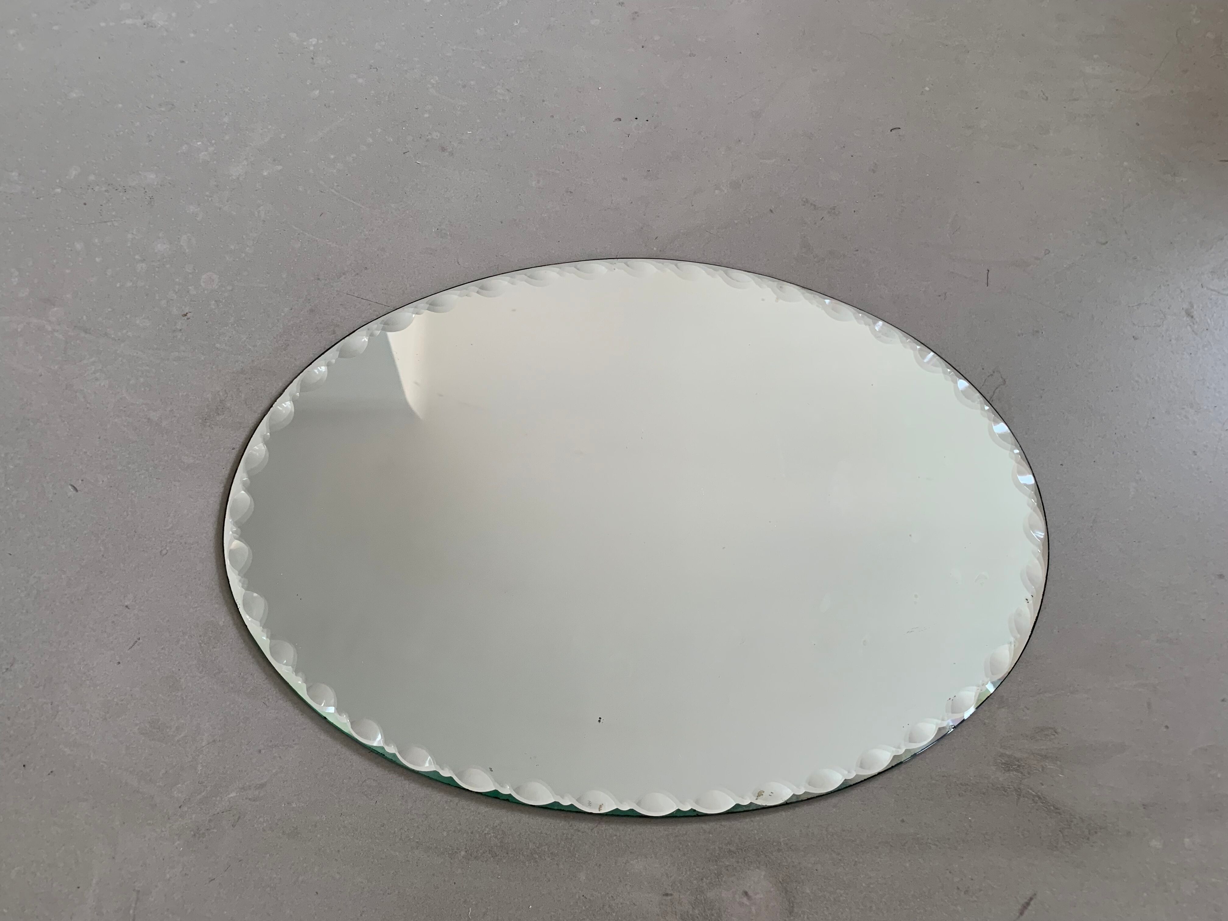 Old beveled oval mirror