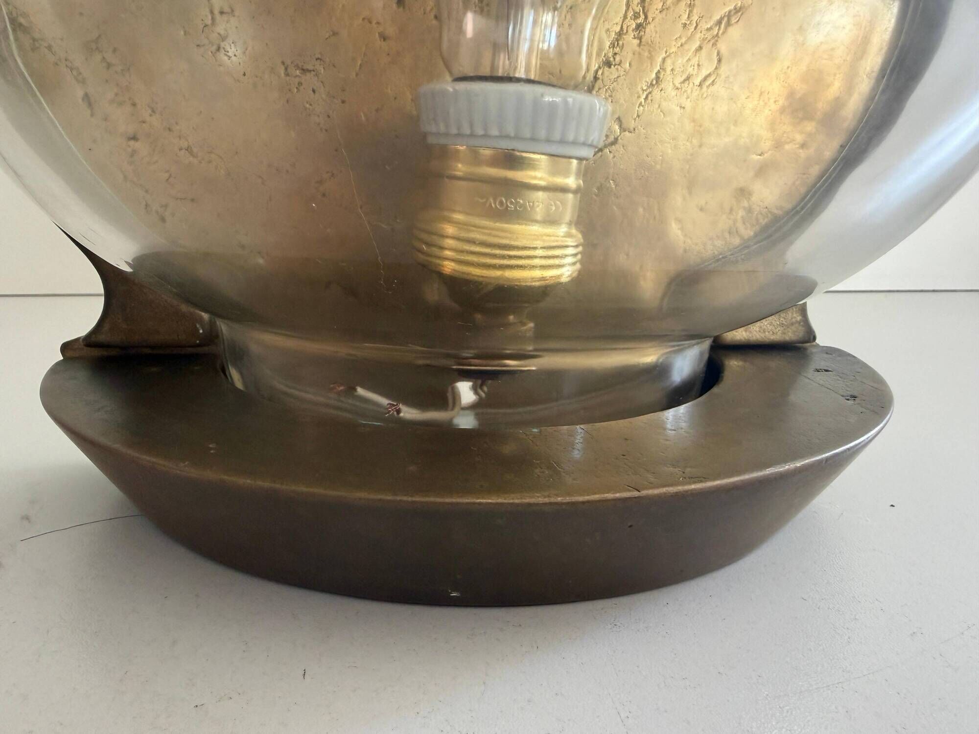 Pair of bronze and glass wall lights from the mid-century, 1960, Italy.