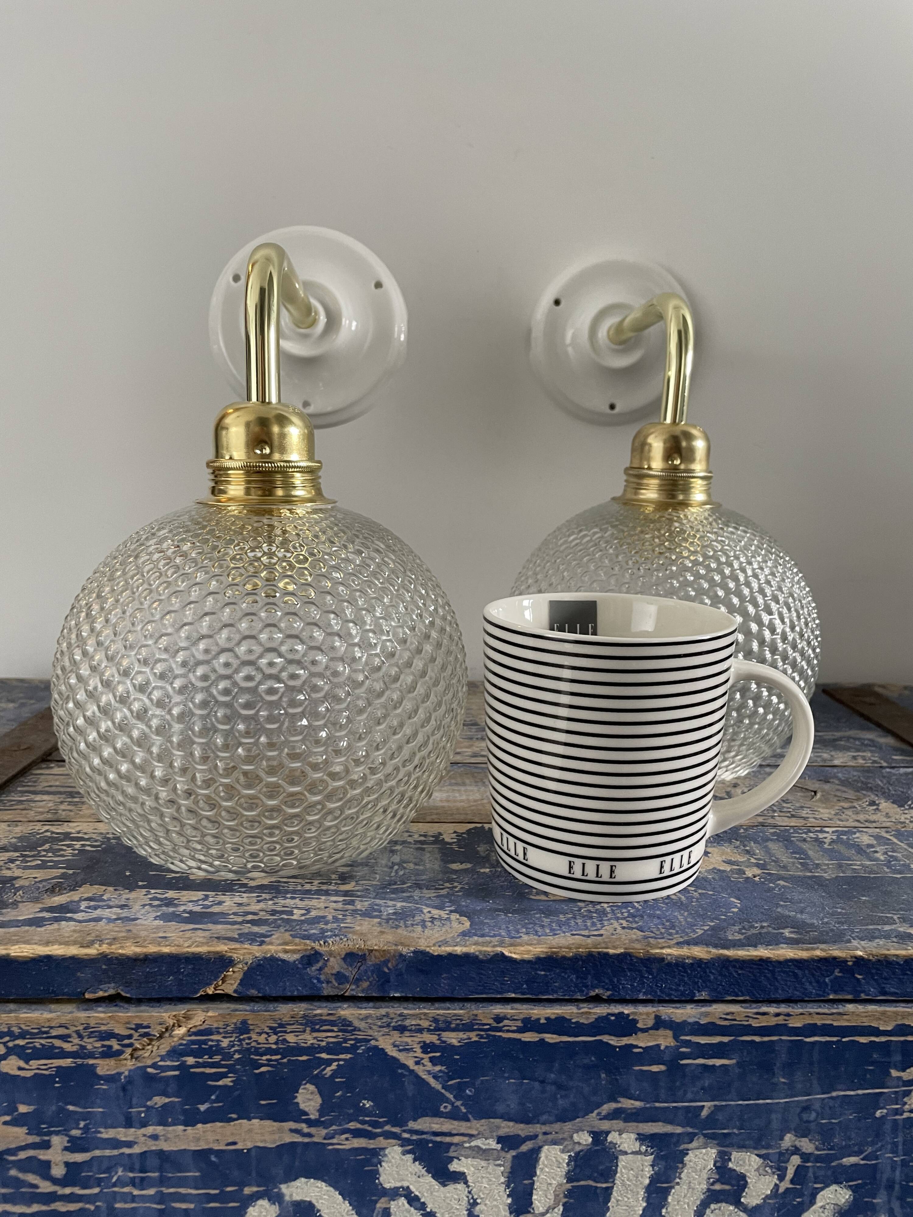 Pair of wall sconces glass globes