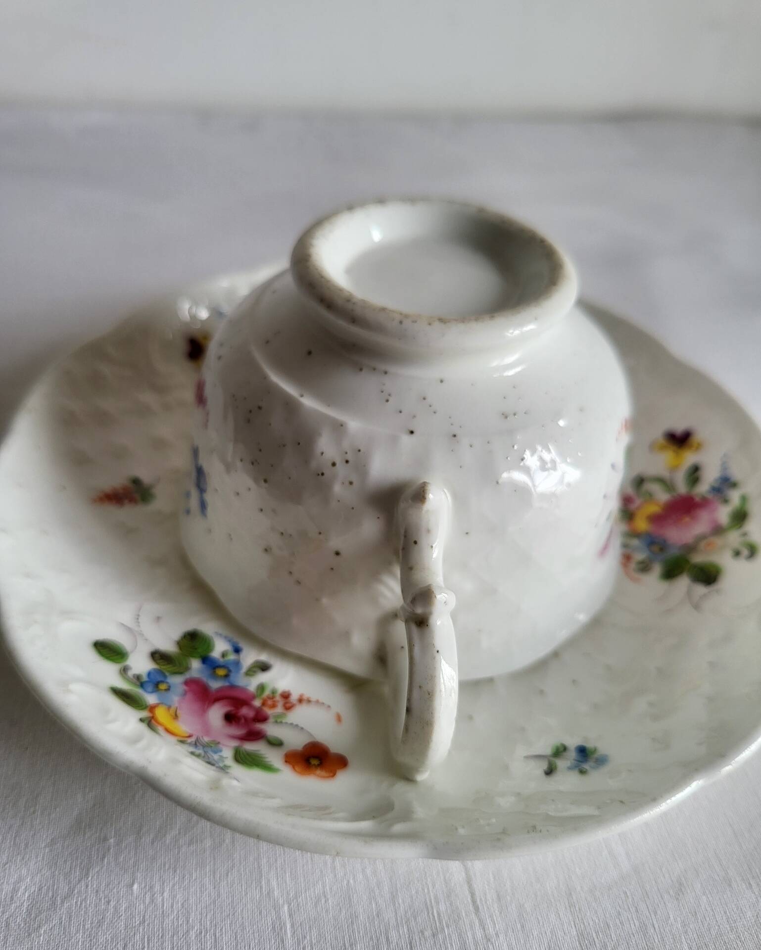 Antique Cup and Saucer in Porcelain with Hand-Painted Floral Decoration