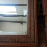 Set of two bevelled mirrors in moulded oak.