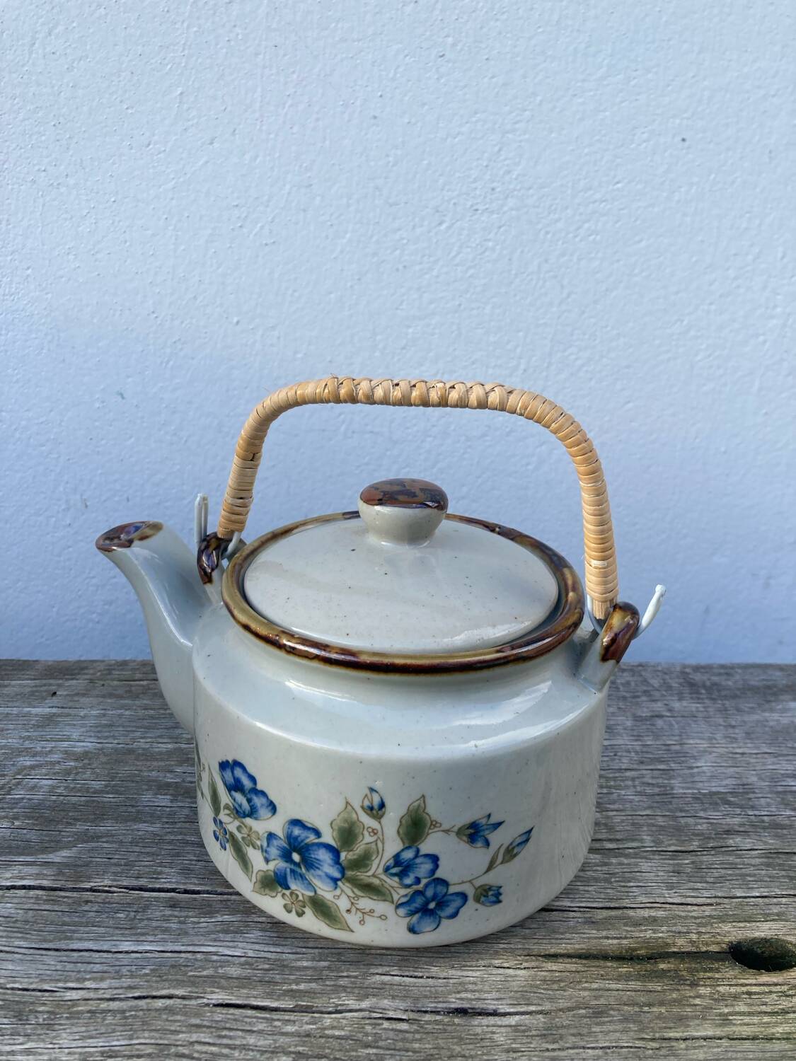 Chinese ceramic and rattan teapot