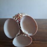 Kitch pot cover in the shape of a shell decore basket