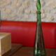 Vintage green faceted glass bottle with its cap 1970